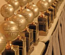 Eisner Awards trophies on table